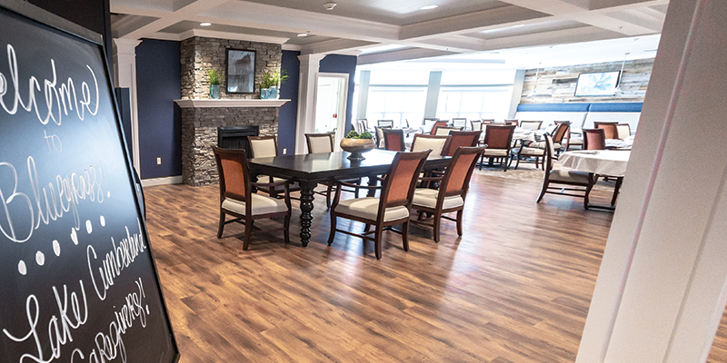 Welcoming dining area with wooden floors and elegant decor.